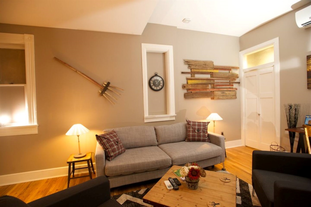 Sofa bed rests under original historic window frames