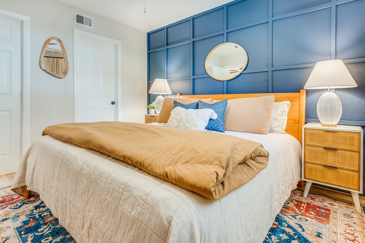 Soft linens and calming tones in this bedroom ensure restful nights.