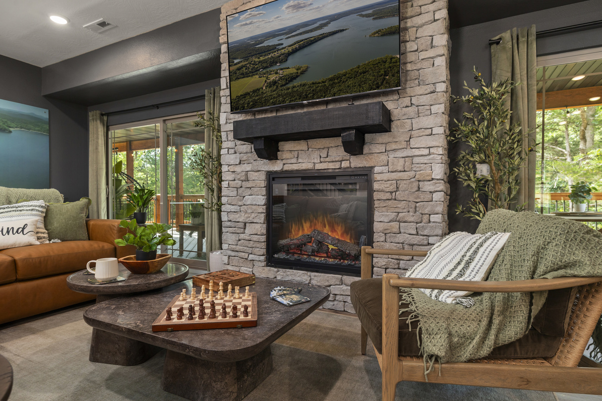 Cozy up to the stacked-stone fireplace with a chess match on the barrel table.