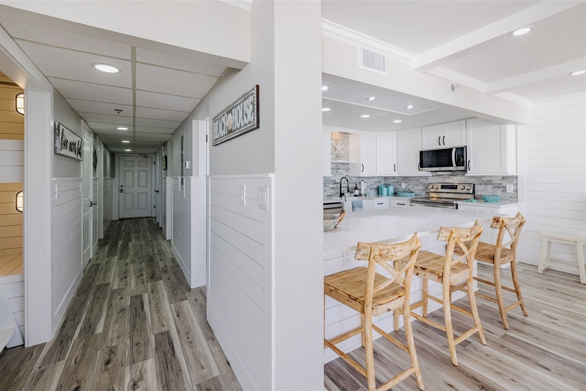 Bar seating and view of entry hall (and bunk nook)