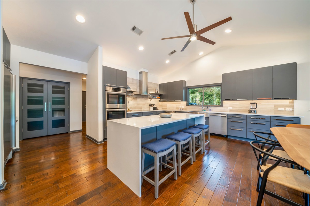 Living Room Connects to the Spacious Eat in Kitchen with Island