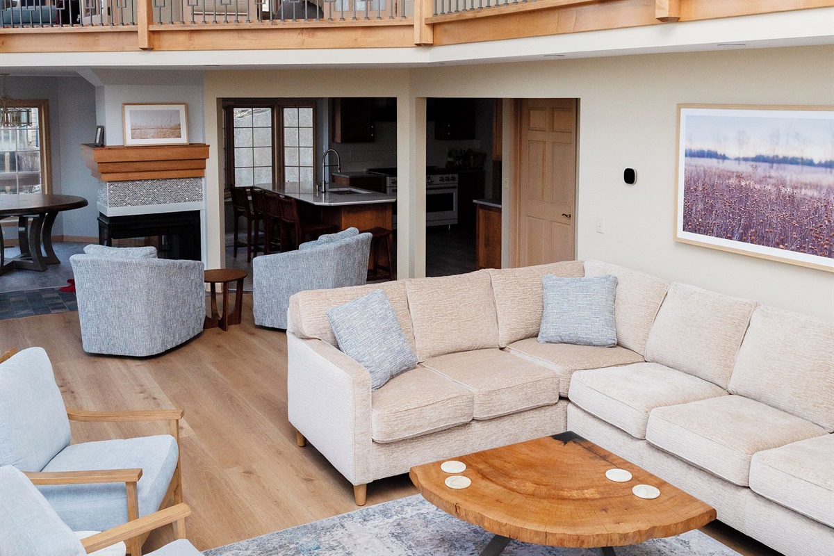 Great Room with Queen Sleeper Sectional & Kitchen in Background