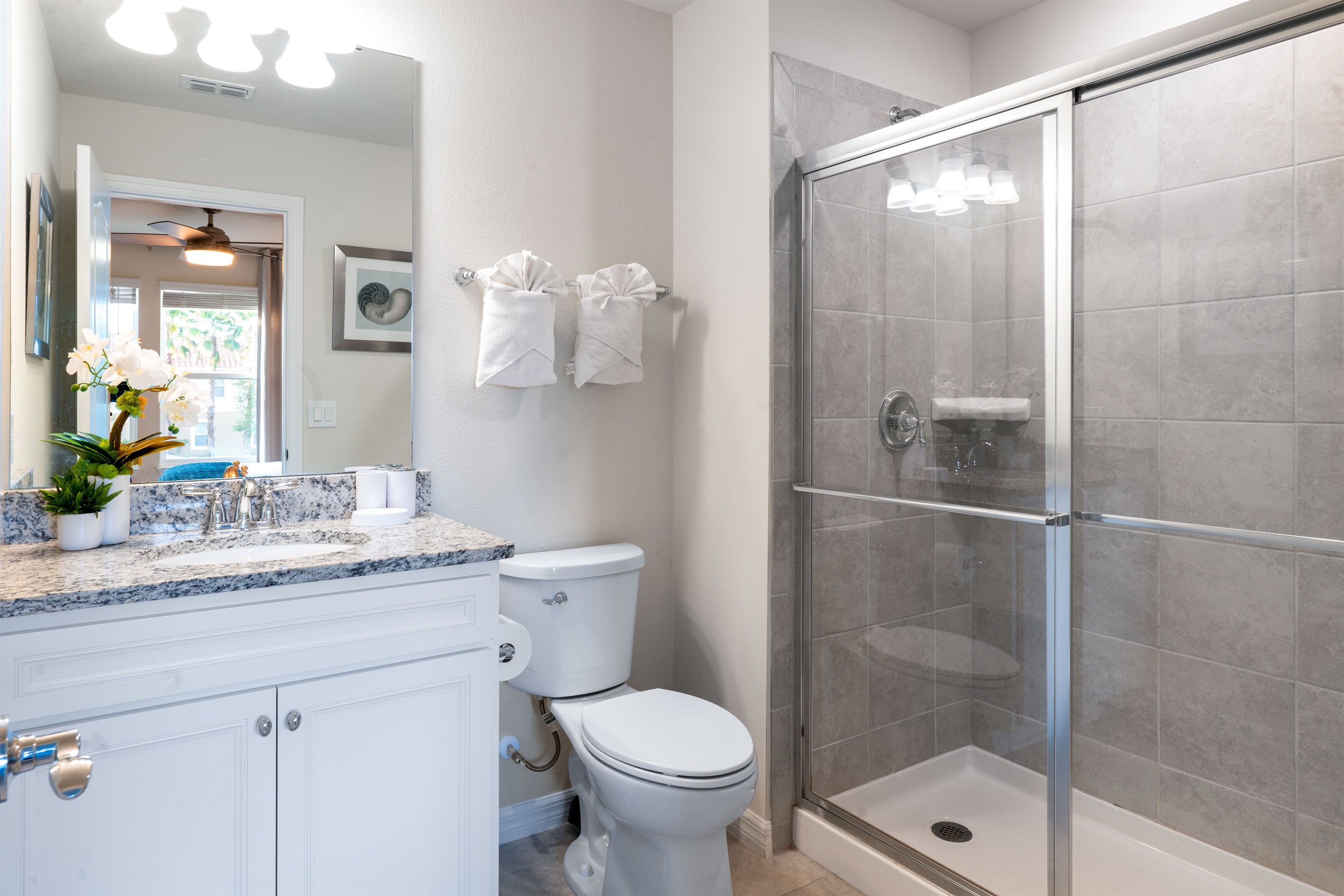 Step into a sleek ensuite bathroom stocked with everyday essentials—designed for both comfort and ease during your Orlando stay.