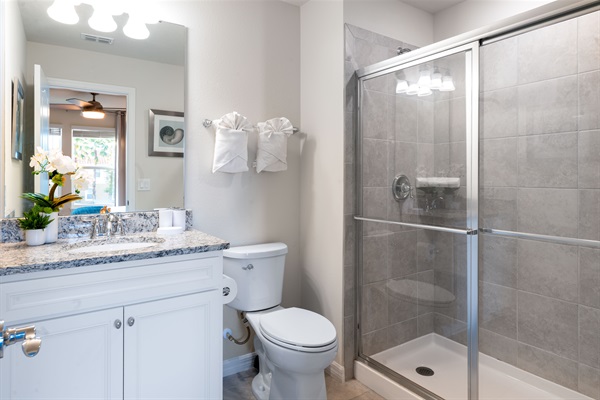 Step into a sleek ensuite bathroom stocked with everyday essentials—designed for both comfort and ease during your Orlando stay.