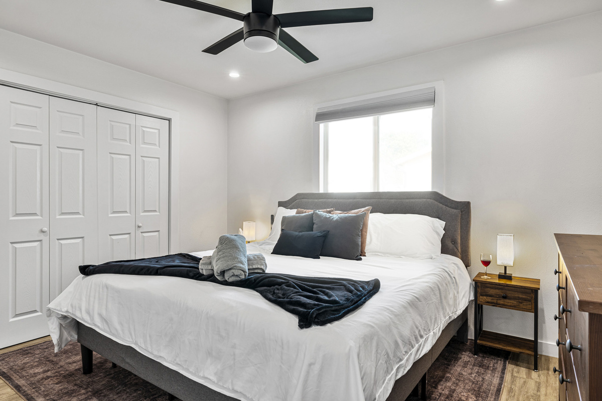 Bright and inviting retreat with plush bedding and a serene view!