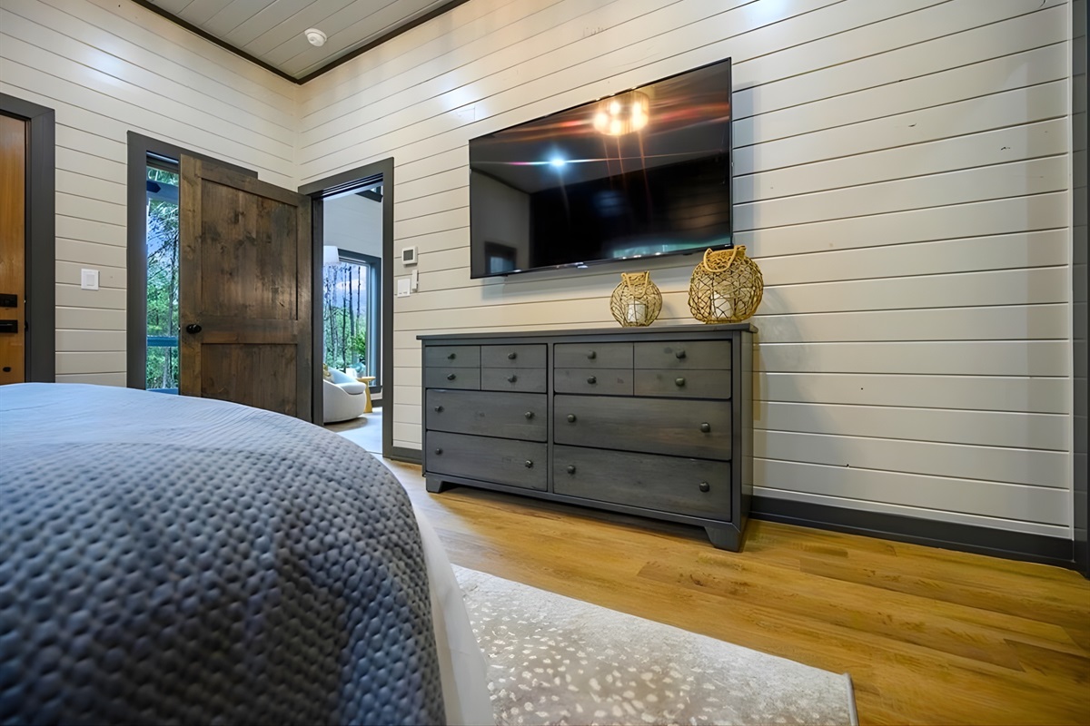 Soft lighting and cozy bedding make this bedroom a peaceful space to recharge after exploring.