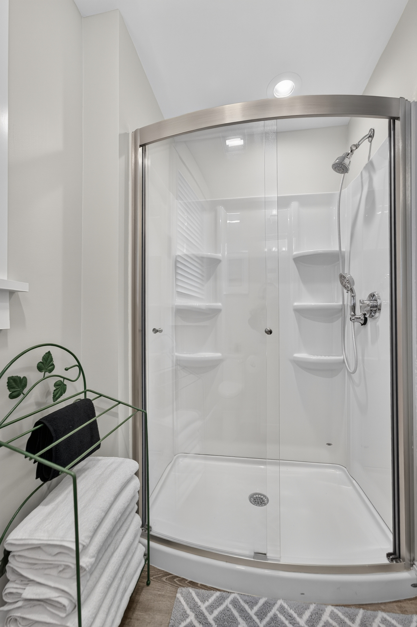 Glass-enclosed walk-in shower offering a fresh, modern bathing experience.