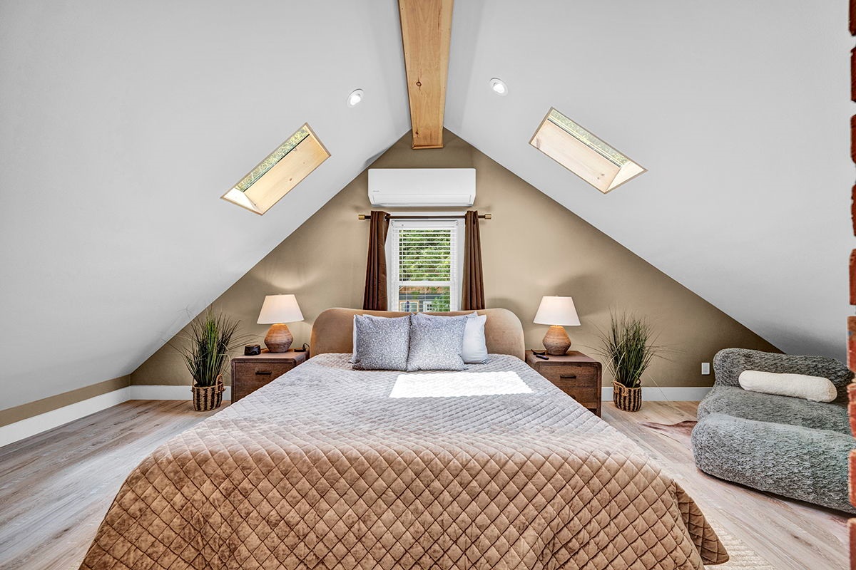Master Bedroom with King Bed, 42-inch Smart TV, Fireplace, sound machine, blackout curtains and cozy reading chair