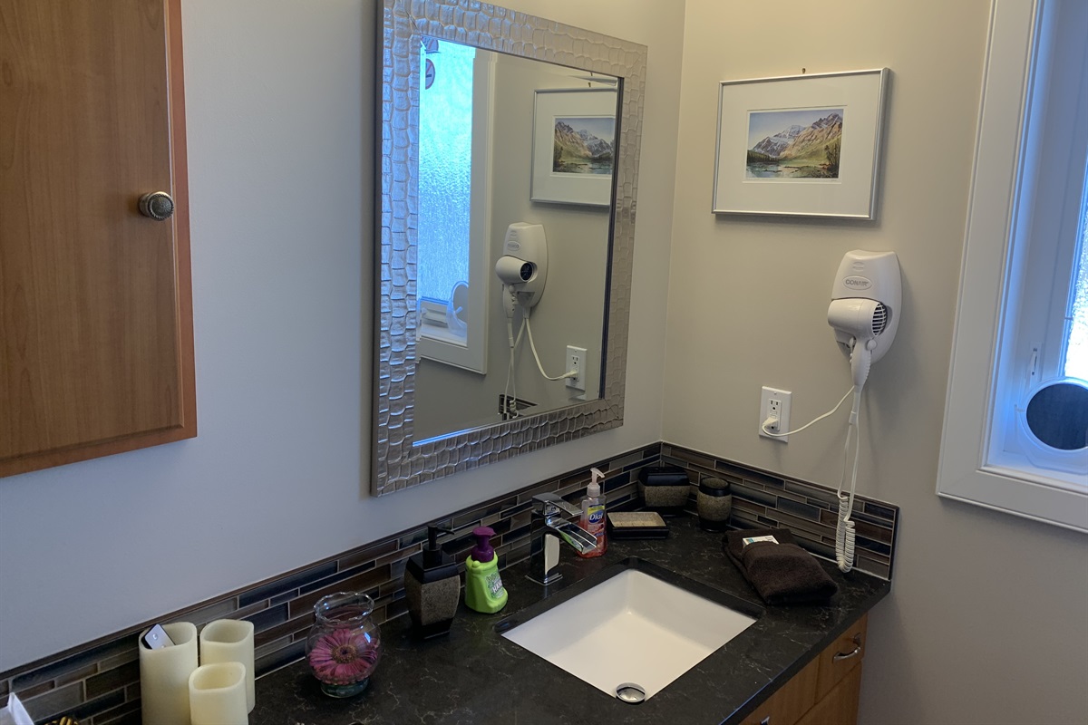 LOFT SUITE BATHROOM. TOWELS UNDER SINK.