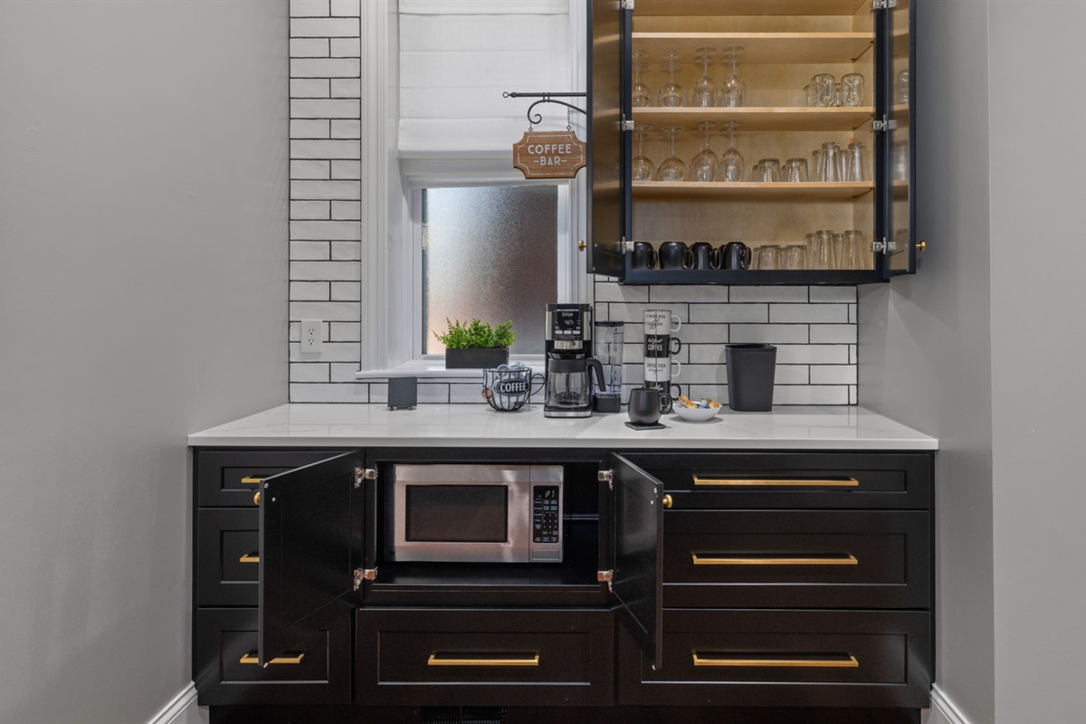 There are a variety of glasses and mugs for any particular need.  Feel free to look around.  Note the microwave is under the cabinet by the coffee bar!