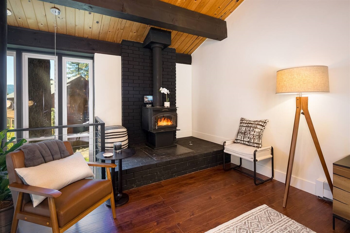Your Cozy Corner – A peaceful nook by the fireplace, ideal for morning coffee, quiet reading, or an intimate fireside chat.  