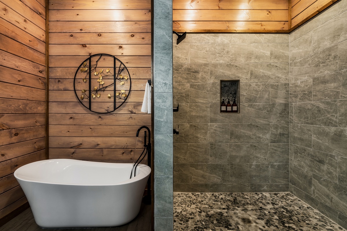 Classic clawfoot soaking tub with black fixtures for a relaxing bath.