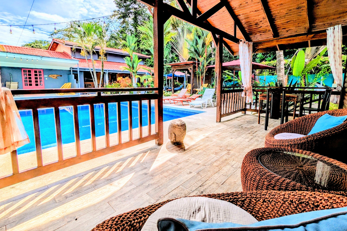 Patio view of pool and across is Cabina Plumeria