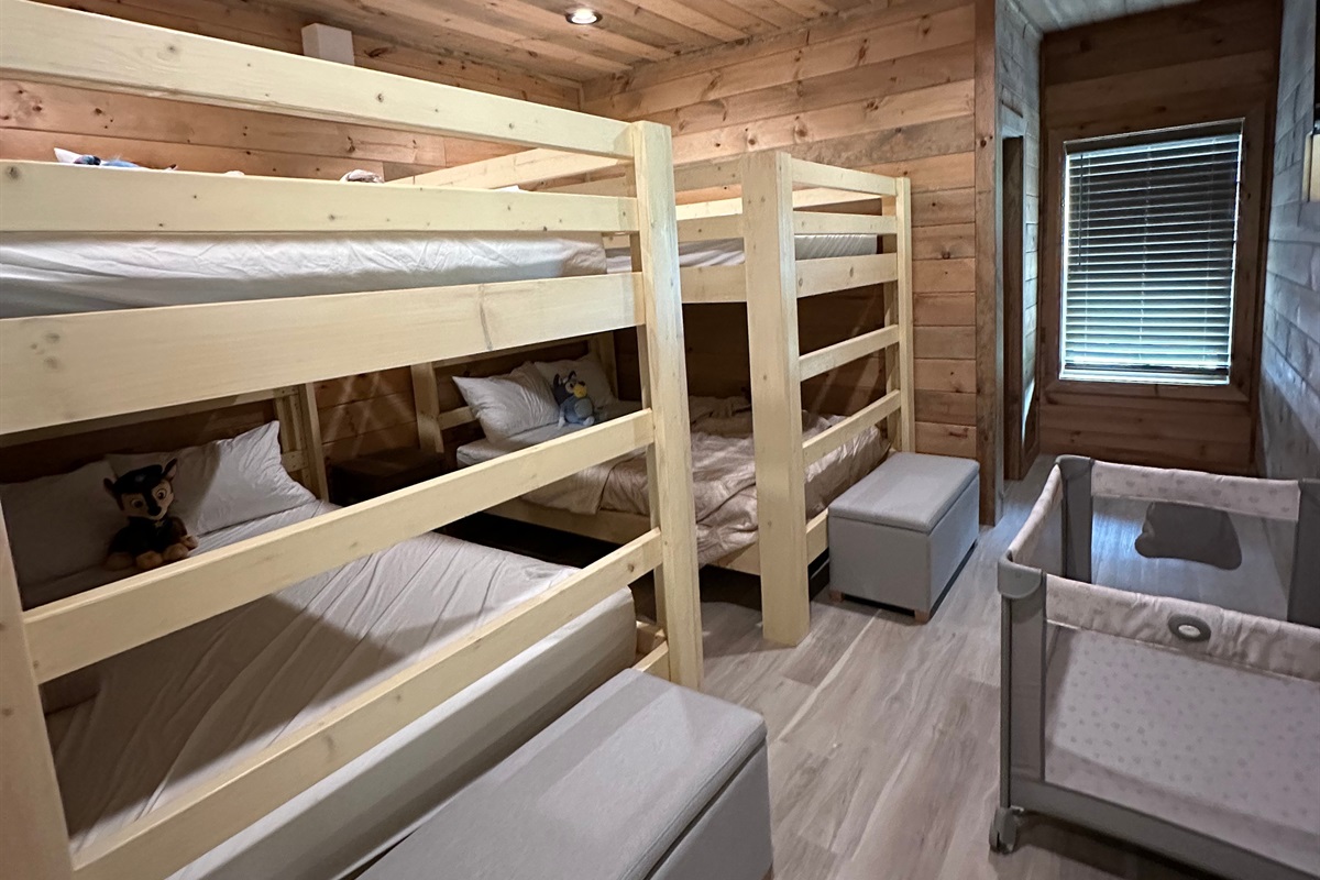 Built for sweet dreams and family stays. This cozy bunk room features sturdy wood bunks, soft bedding, and thoughtful space for little ones to unwind after full days of mountain adventure.