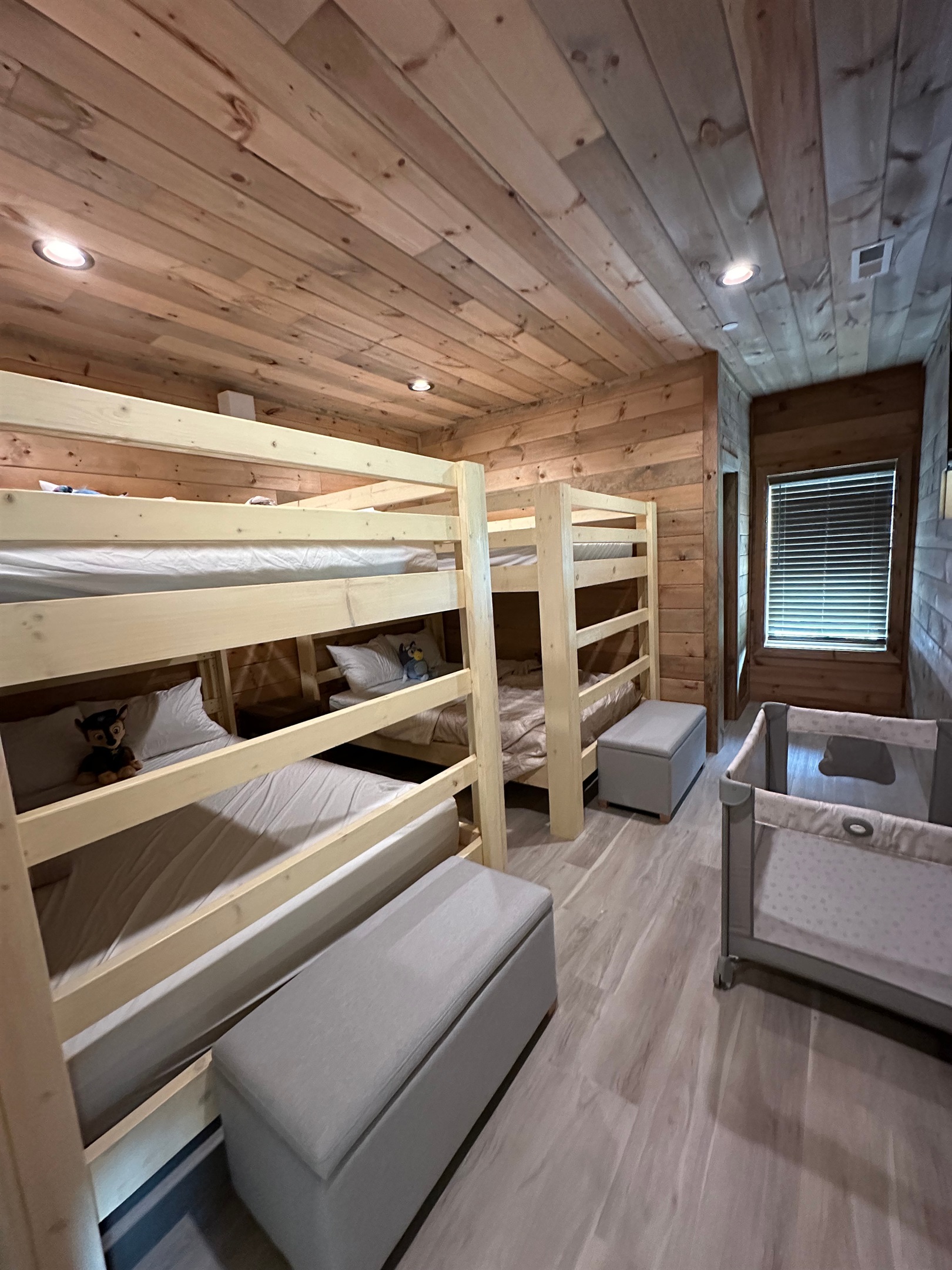 Built for sweet dreams and family stays. This cozy bunk room features sturdy wood bunks, soft bedding, and thoughtful space for little ones to unwind after full days of mountain adventure.