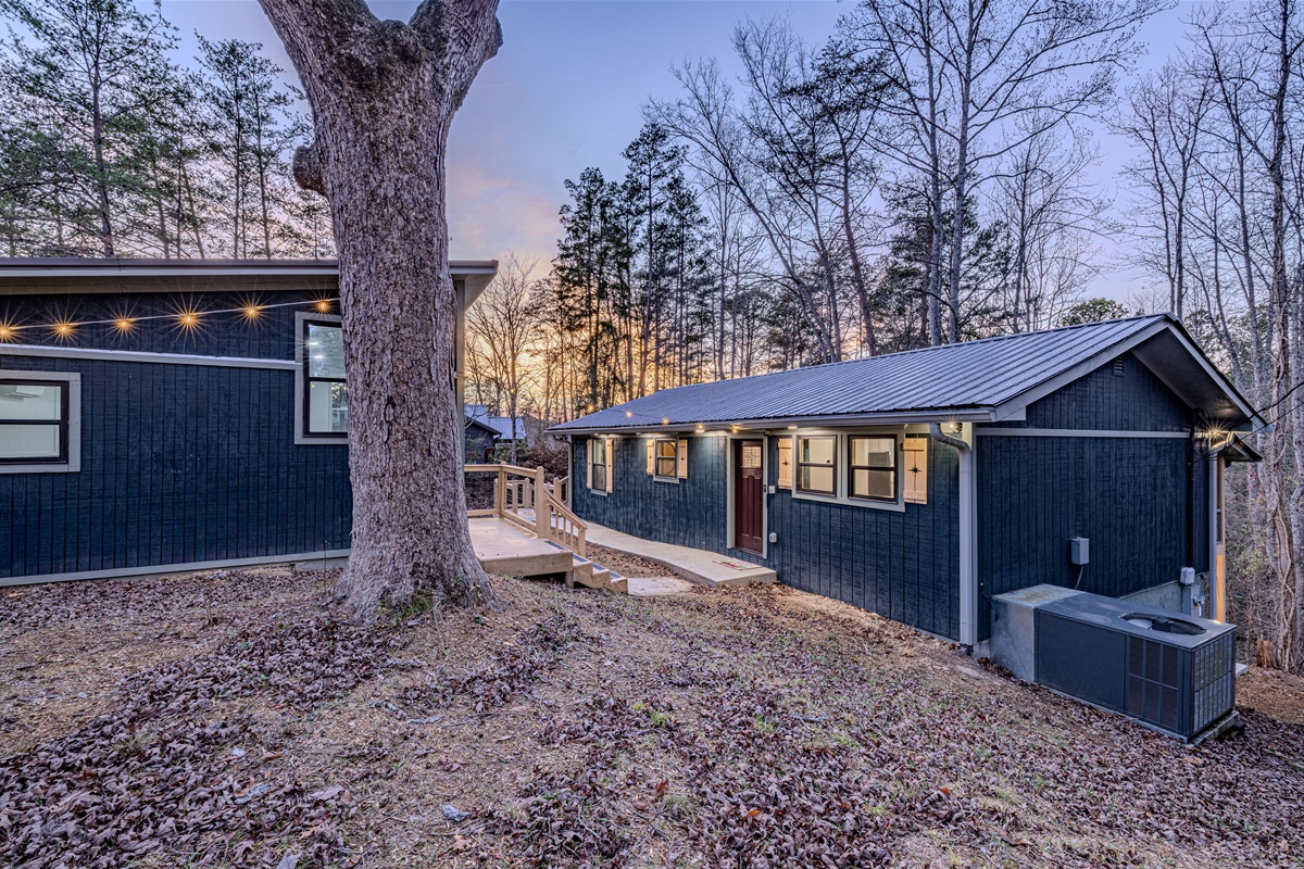 The architectural beauty of our cabin shines from every angle, featuring a massive deck that wraps around the back of the home.