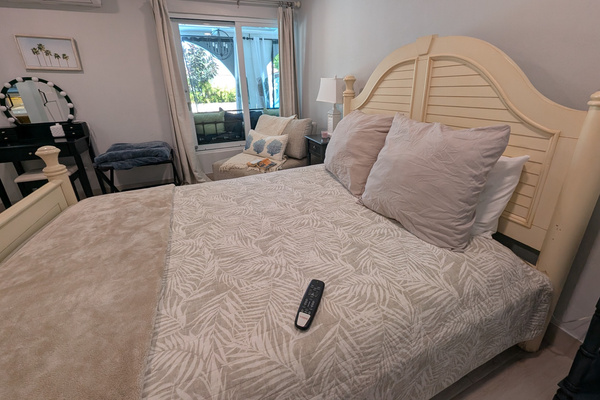 View across queen adjustable bed with remote for lifting head and feet and included massage. 