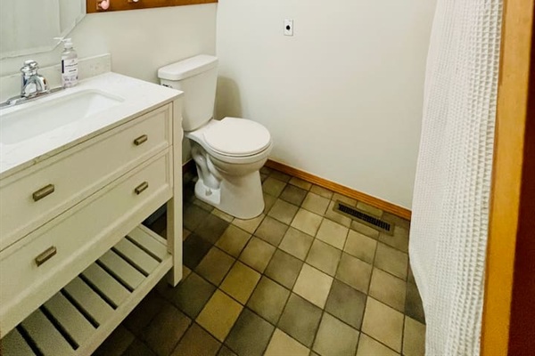 Bathroom vanity area with ample space for getting ready.
