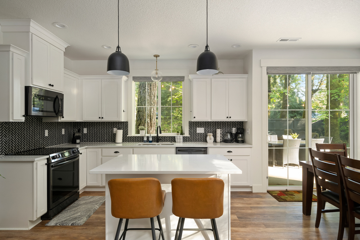 A chef-ready kitchen with quartz counters and herringbone tile, made for cooking up mountain memories.