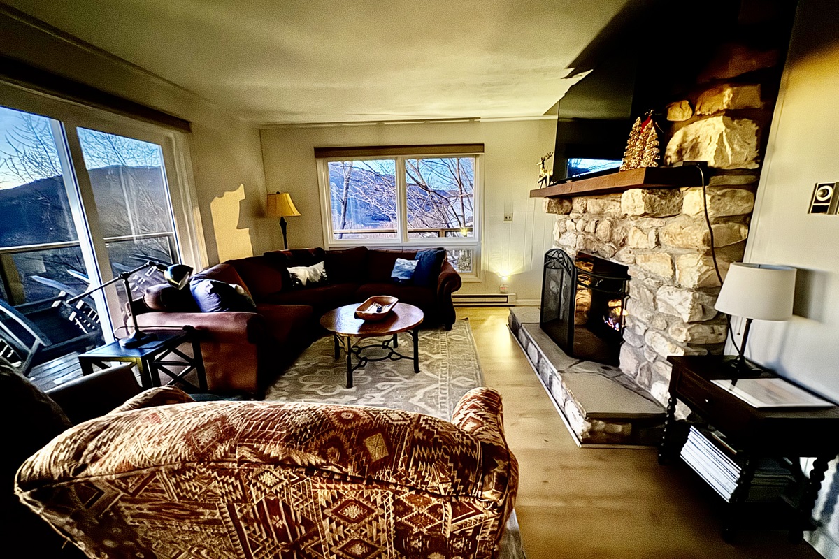 This Living Room has a sectional sofa, a wingback chair & a reclining chair in front of the gas log fireplace with amazing views. Need more seating? Pull over a dining chair, or send them to the game room! ;)