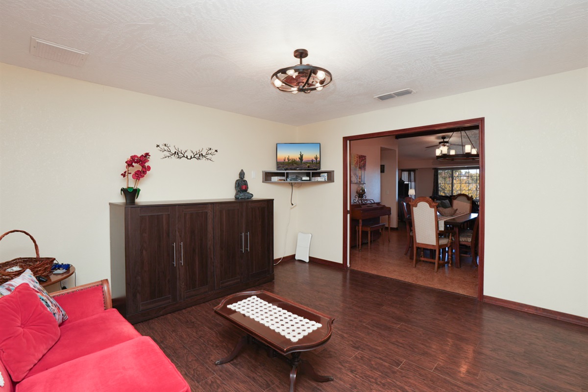 Versatile den with queen Murphy bed, double doors for privacy, smart TV, and Wii gaming system—great for extra guests or kids.