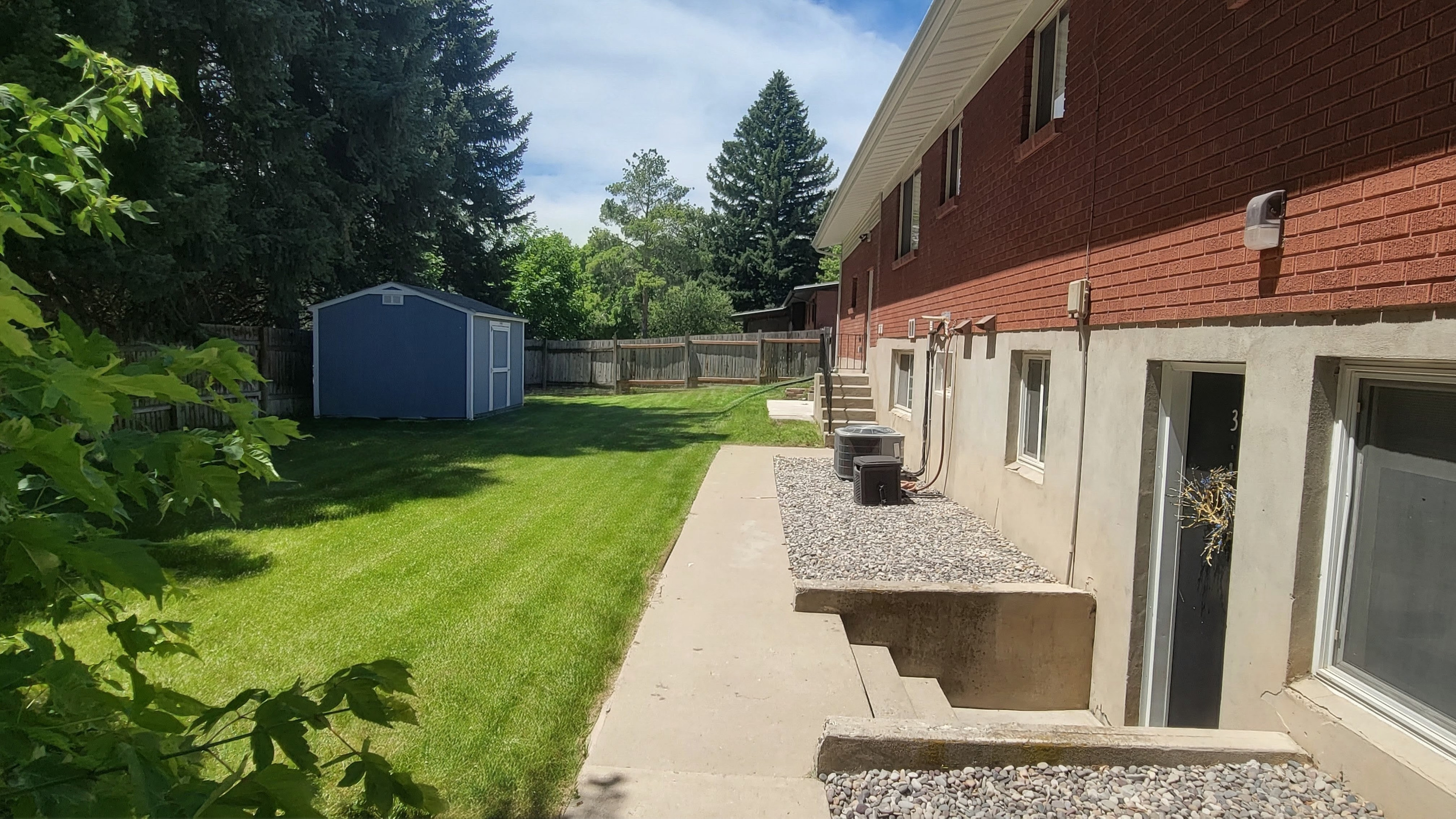 Backyard, the entrance to the apartment is to the bottom right of this photo.