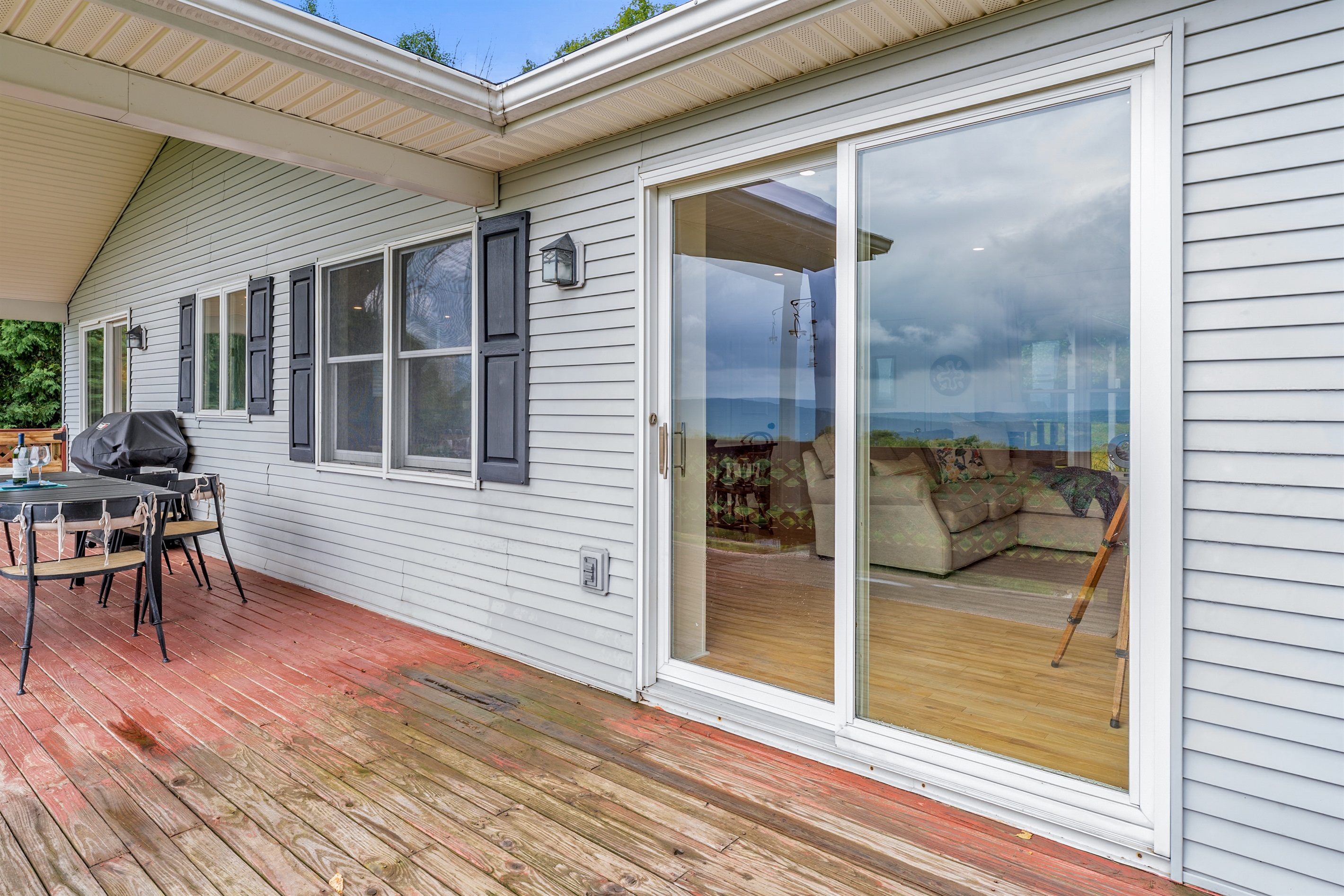 This spacious deck invites you to unwind with a meal, a drink, or a good book—all with a peaceful backdrop.