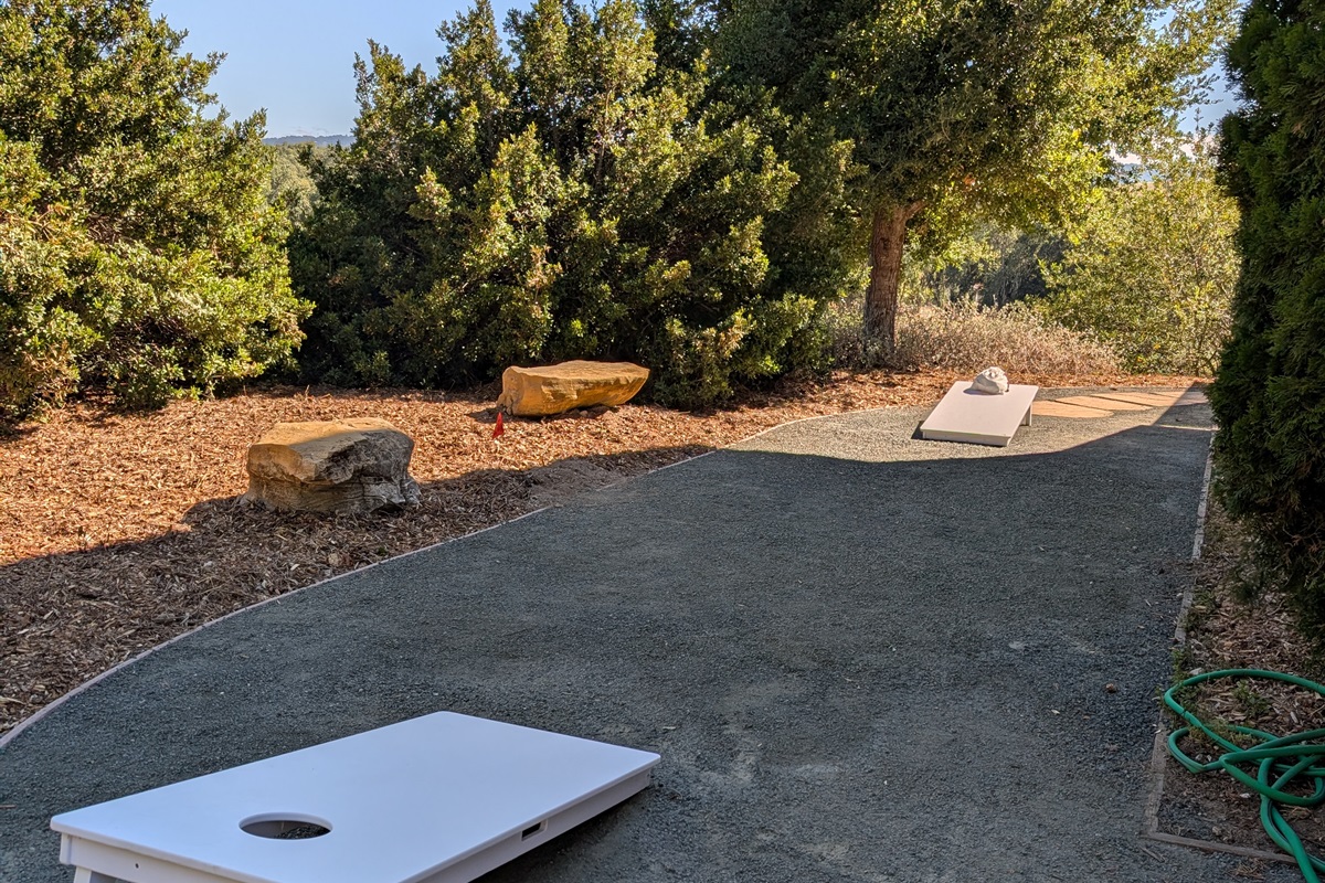 Cornhole set on side of home