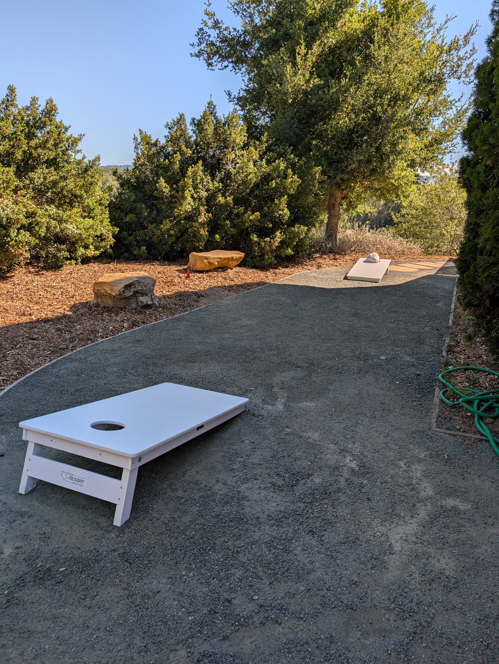 Cornhole set on side of home