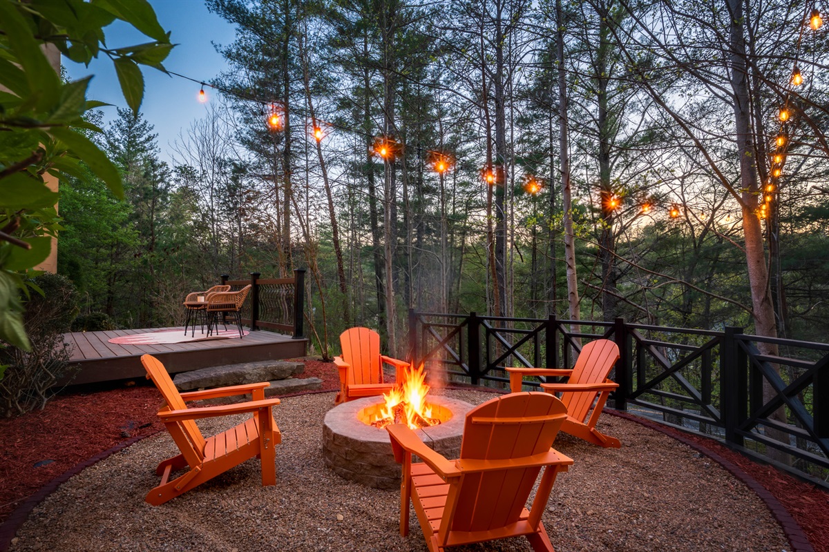 Fire pit lounge surrounded by trees - perfect for winding down after a day exploring the Blue Ridge Parkway