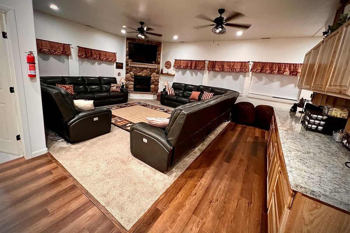 Enter into the cabin into the cozy Great Room.   Recline in the Italian Leather Sectionals and watch a movie from the 55" TV over the River rock Fireplace.