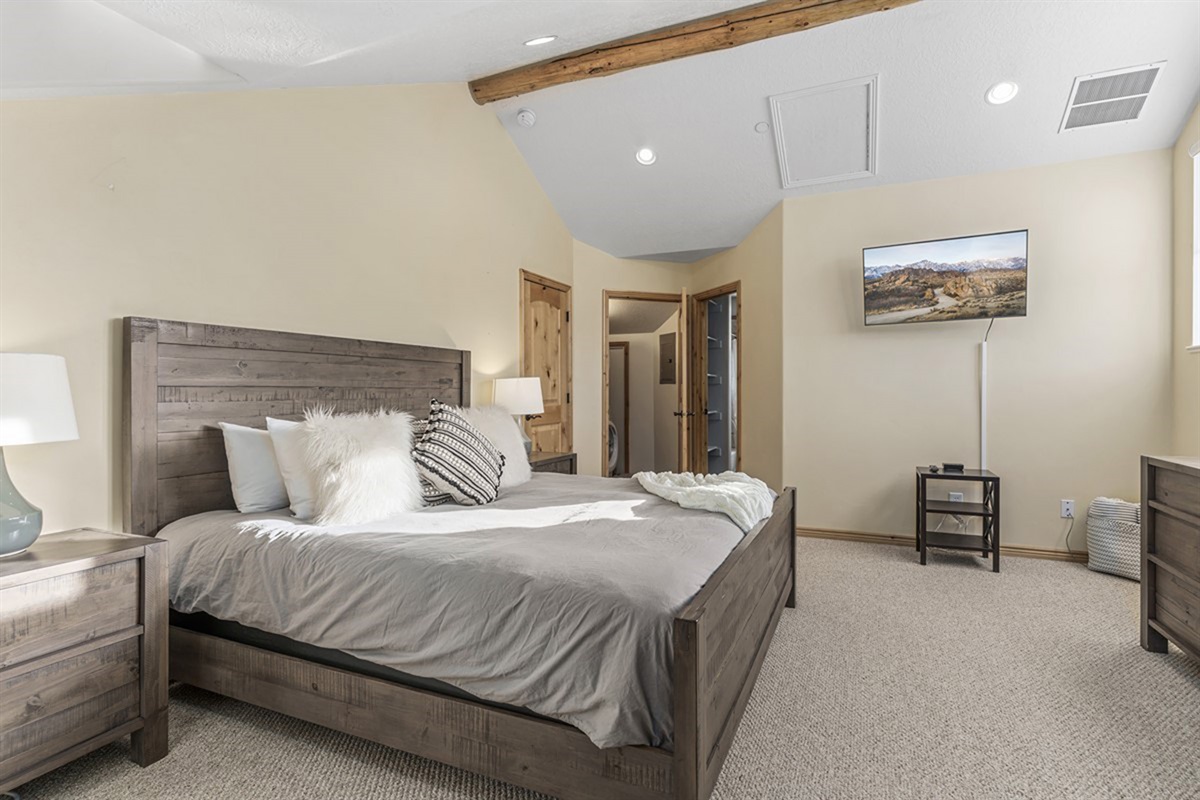 Another inviting bedroom designed for rest, comfort, and a great night’s sleep.