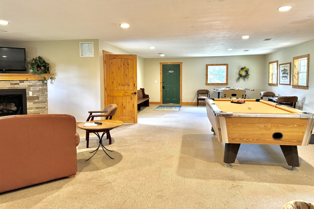 The game room in the clubhouse has a TV area, pool table, foosball and so much more!