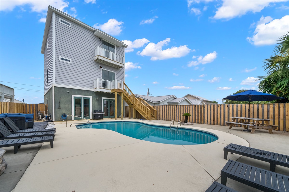 Outside Grill, lounge chairs, picnic table...  Grill, chill, savor- pool days done right 