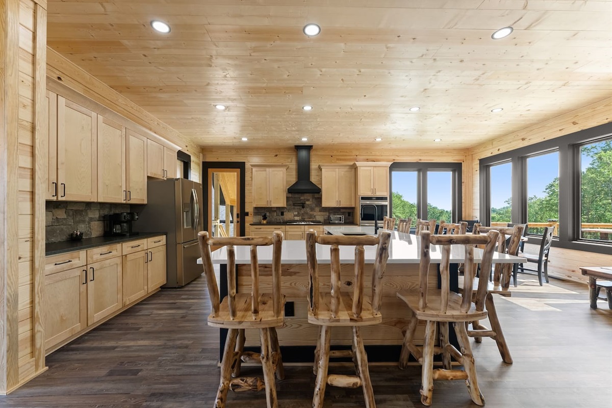 Fully equipped with stainless steel appliances, tons of prep space, and rustic charm—this gourmet kitchen makes cooking for a crowd a pleasure.