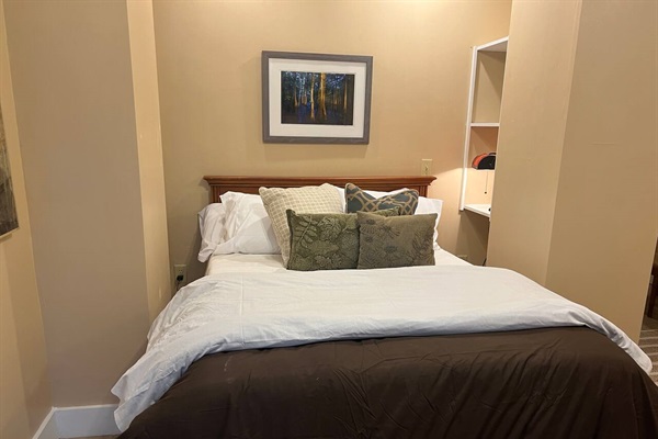 The Cypress Room has a double bed and two hotel-style rollaway twin beds in the closet.