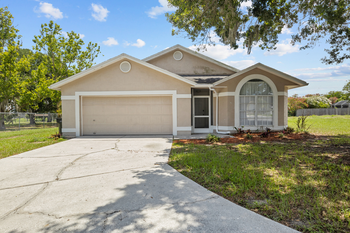 Front of home, driveway, & garage.