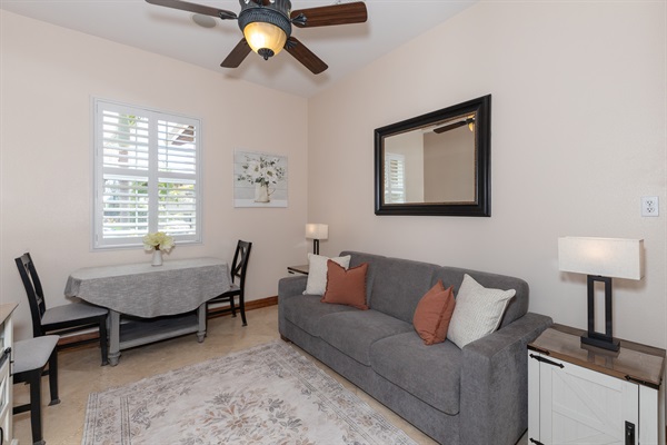 Bright living area with seating, dining table, and natural light