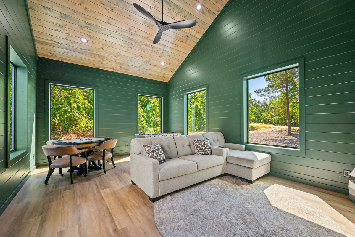 The game room adds another fun hangout spot with plenty of space to relax, play, and spend time together.