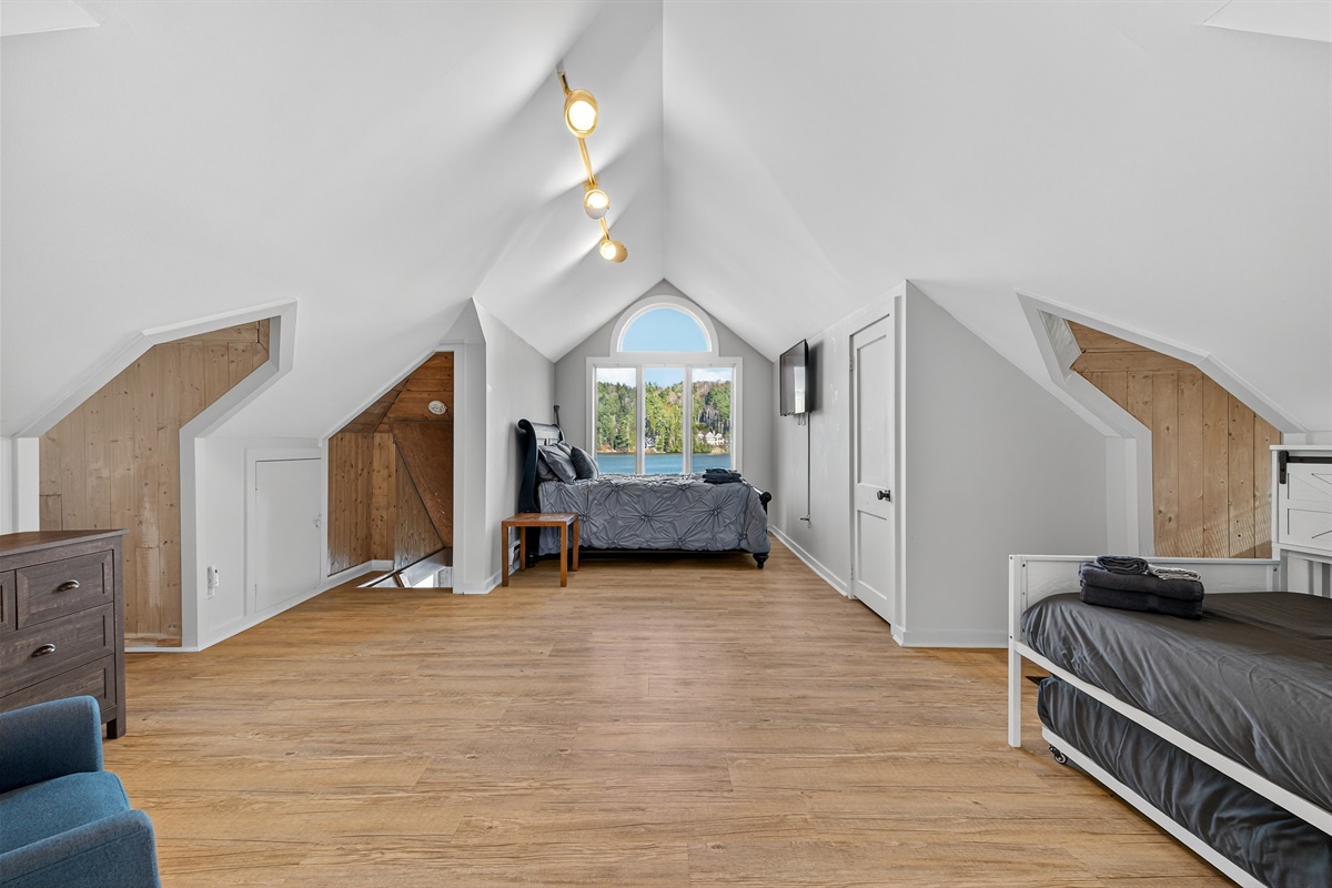 Main bedroom of the home boasts a cozy queen bed and a trundle that pulls out for 2 singles!