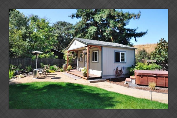 Cozy backyard setup w/ garden views & a relaxing hot tub area