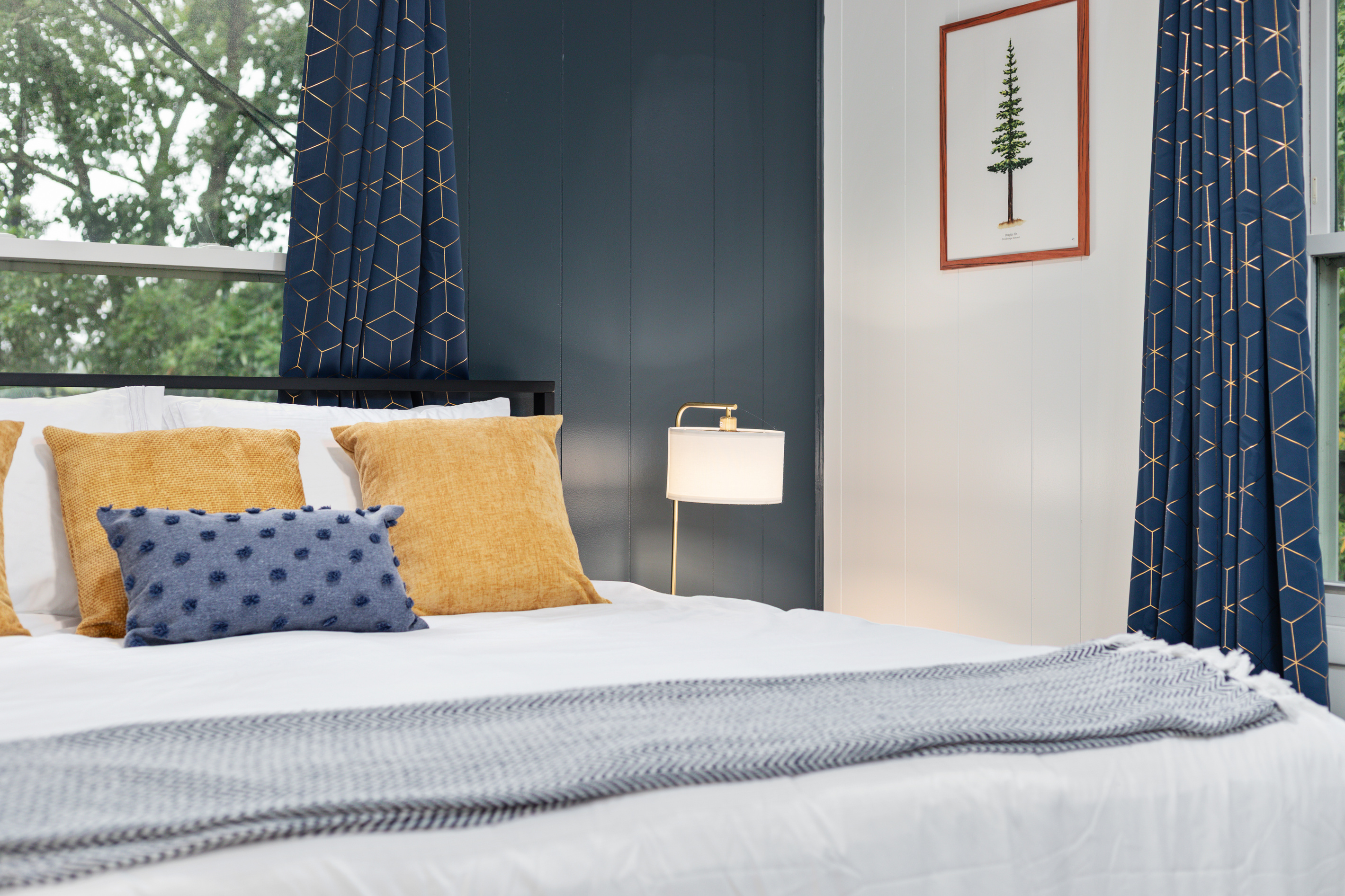 Sink into crisp linens and a plush king bed — one of three peaceful bedrooms designed for a good night's rest.