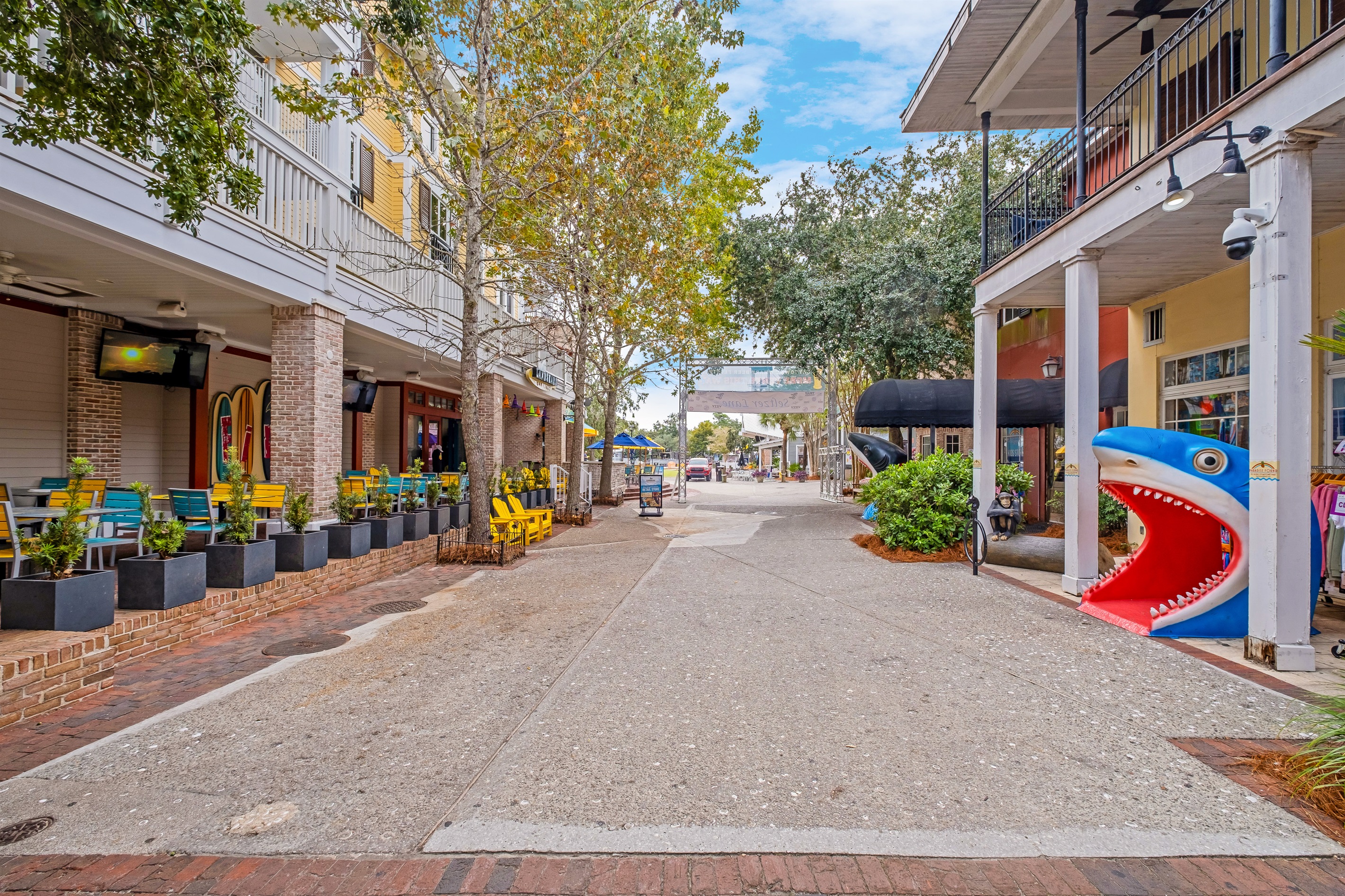 Bright and colorful storefronts on a bustling pedestrian street. Ideal for window shopping and discovering unique local finds.