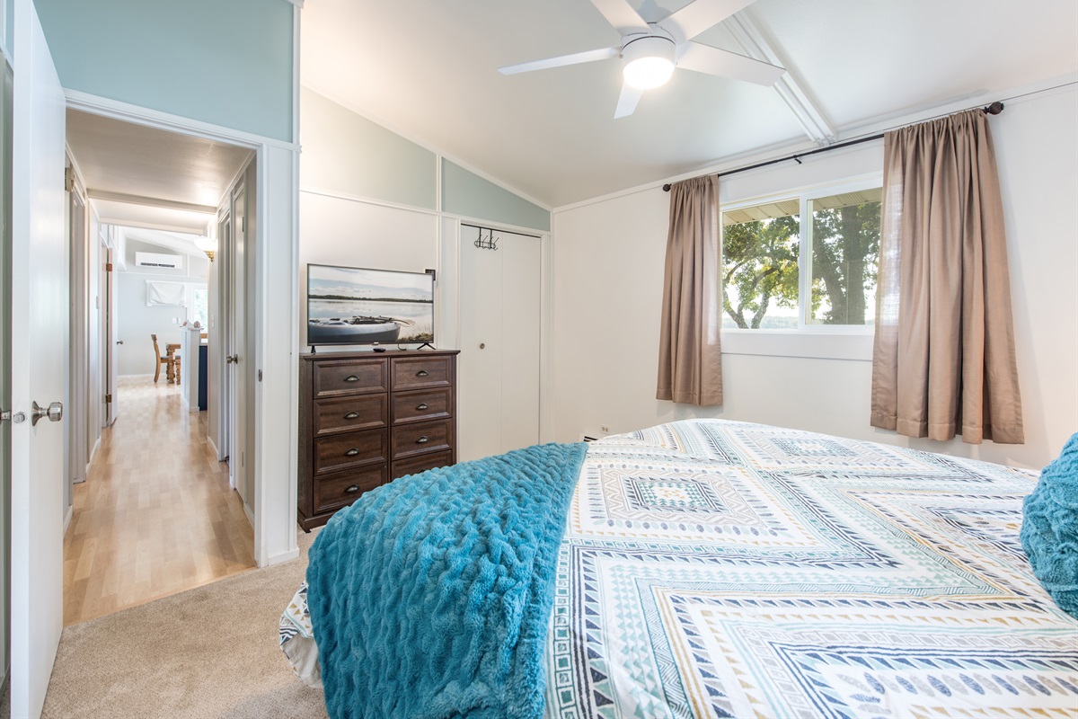 Bedroom 1 with lake view and TV