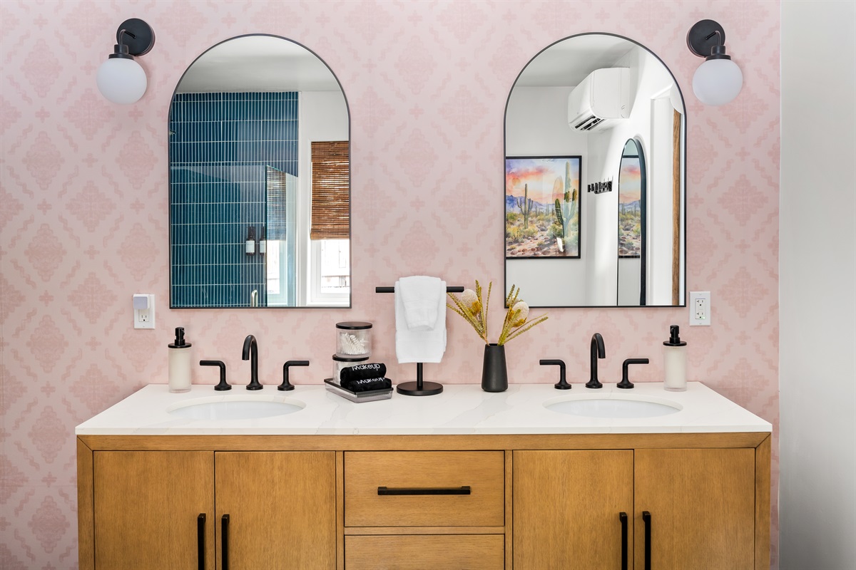 Beautiful ensuite bathroom connected to the primary bedroom, featuring a double vanity and modern shower.