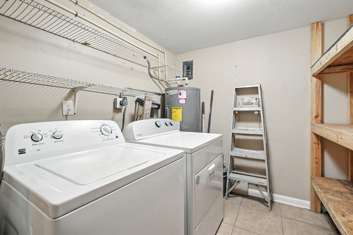 Laundry room with storage, washer and dryer