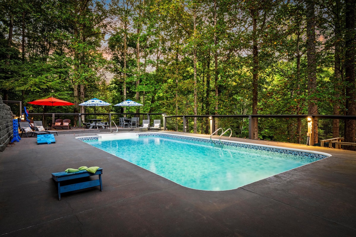 This fully remodeled log cabin pairs rustic beauty with modern comfort as you spend sunny afternoons by the pool and peaceful evenings listening to the river flow nearby.