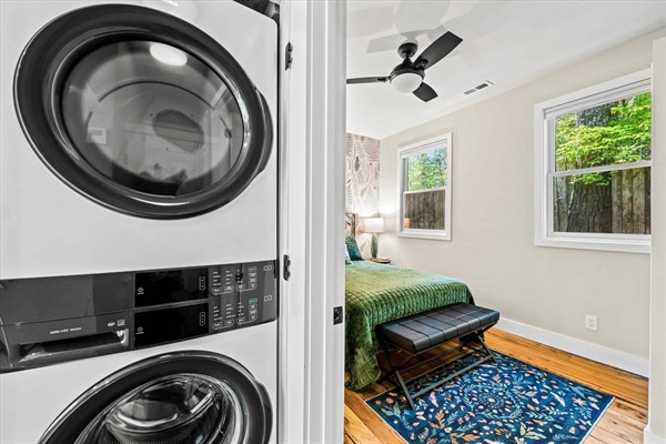 New Electrolux stackable washer and dryer is located next to the kitchen.