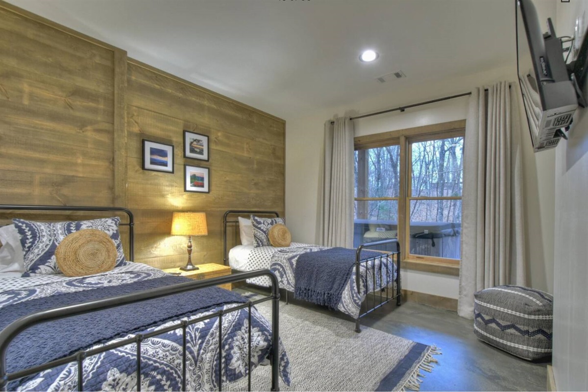 Two twin beds in bedroom on the lower level