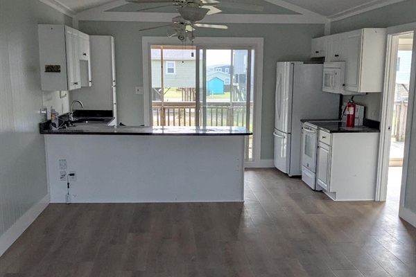 Inside is officially done! Just need to get furniture in now. This is the view from the living room to the kitchen.
